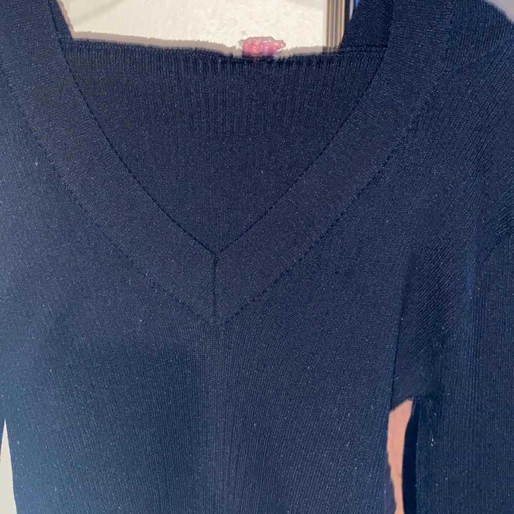 Women’s low v-neck stretchy long sleeve sweater with hoodie.
